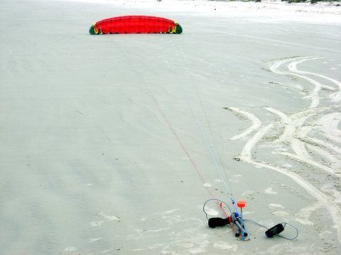 Photo of a Flexifoil Blade parked with handles staked to ground.