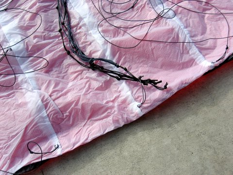 Image close-up of bridle lines tied off at the trailing edge of the kite with a larks head knot to prevent tangles