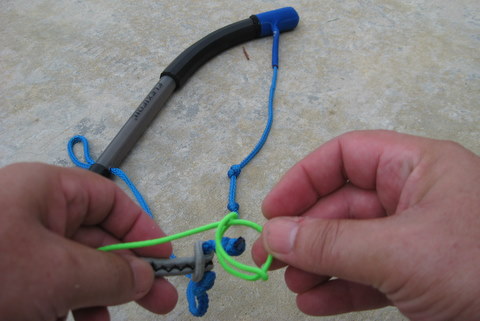 photo of forming a loop with thumb and forefinger for a larks head knot